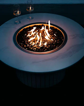 Black rectangular fire table in a modern garden